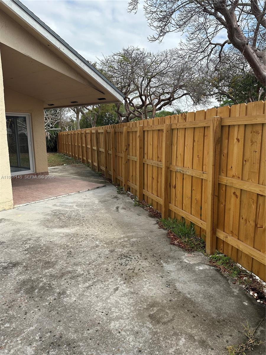 5861 Southwest 152nd Court Miami, FL 33193 - Photo 26 of 26 a view of a backyard with wooden fence