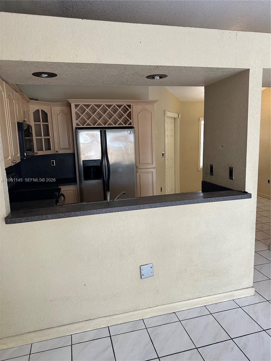 5861 Southwest 152nd Court Miami, FL 33193 - Photo 5 of 26 a living room with a large mirror