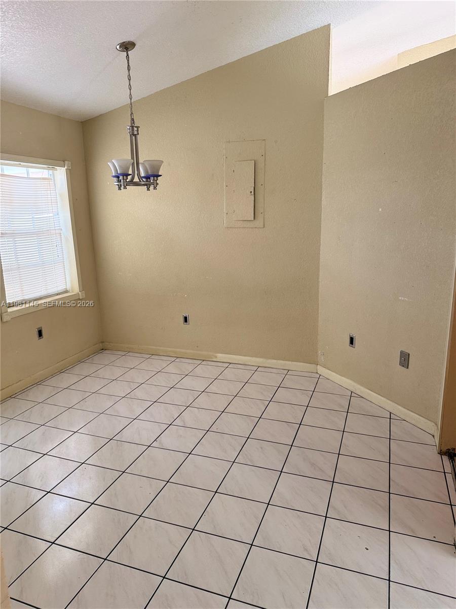 5861 Southwest 152nd Court Miami, FL 33193 - Photo 8 of 26 a view of an empty room and window