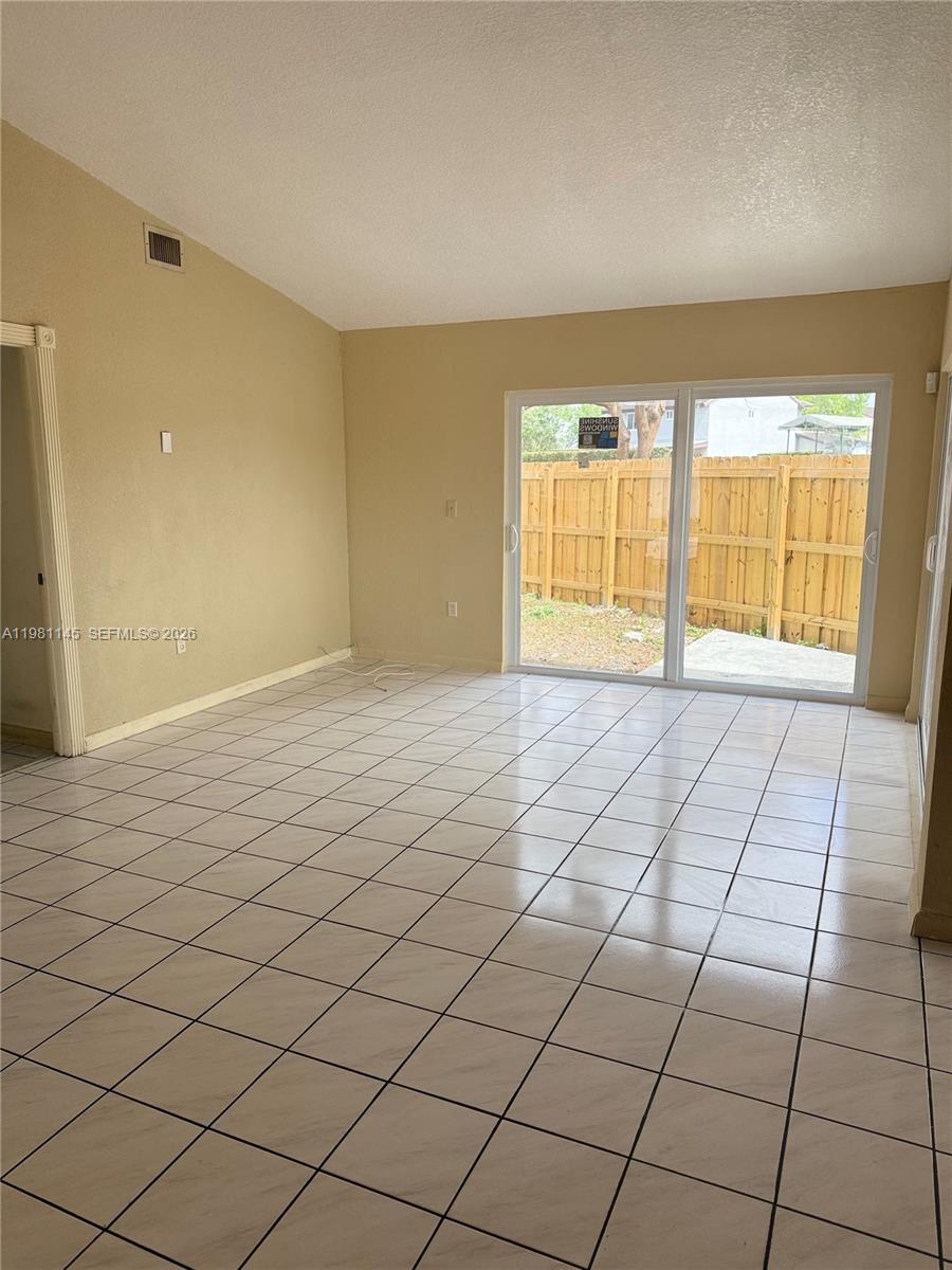 5861 Southwest 152nd Court Miami, FL 33193 - Photo 9 of 26 a view of an empty room and window