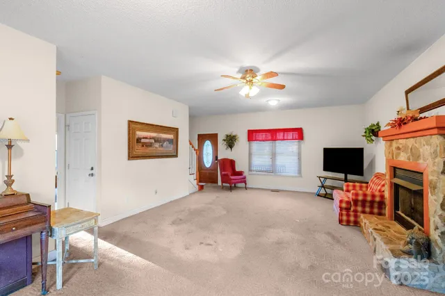 a view of a livingroom with furniture and a flat screen tv
