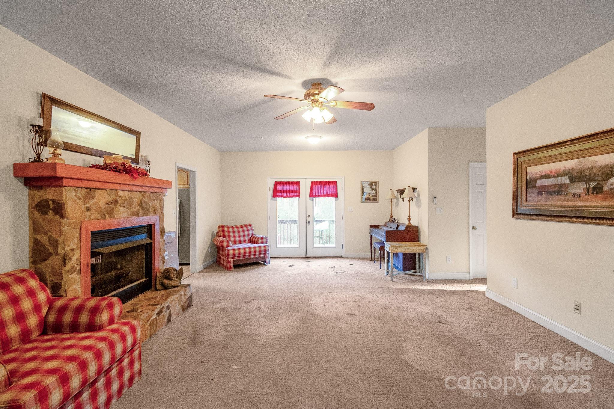 2775 State Rd S-29-285 Lancaster, SC 29720 - Photo 18 of 48 a living room with furniture and a fireplace