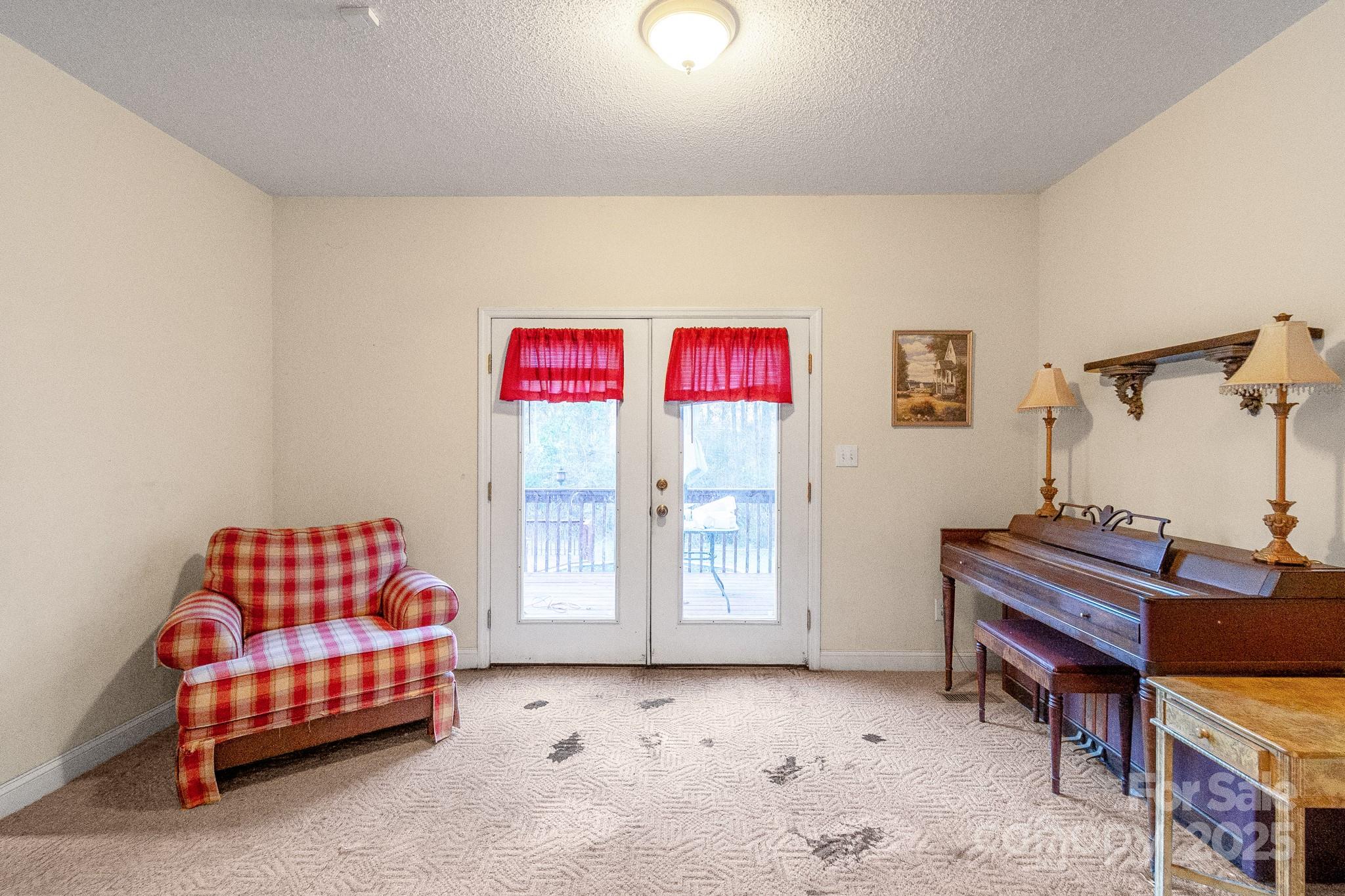 2775 State Rd S-29-285 Lancaster, SC 29720 - Photo 20 of 48 a living room with furniture and a baby crib