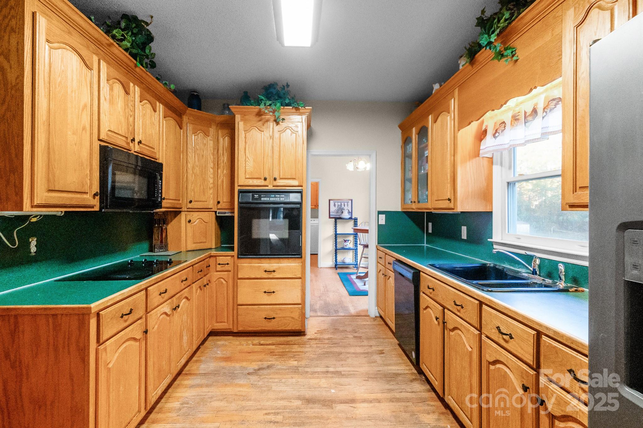 2775 State Rd S-29-285 Lancaster, SC 29720 - Photo 21 of 48 a kitchen with stainless steel appliances kitchen island granite countertop a stove and a sink