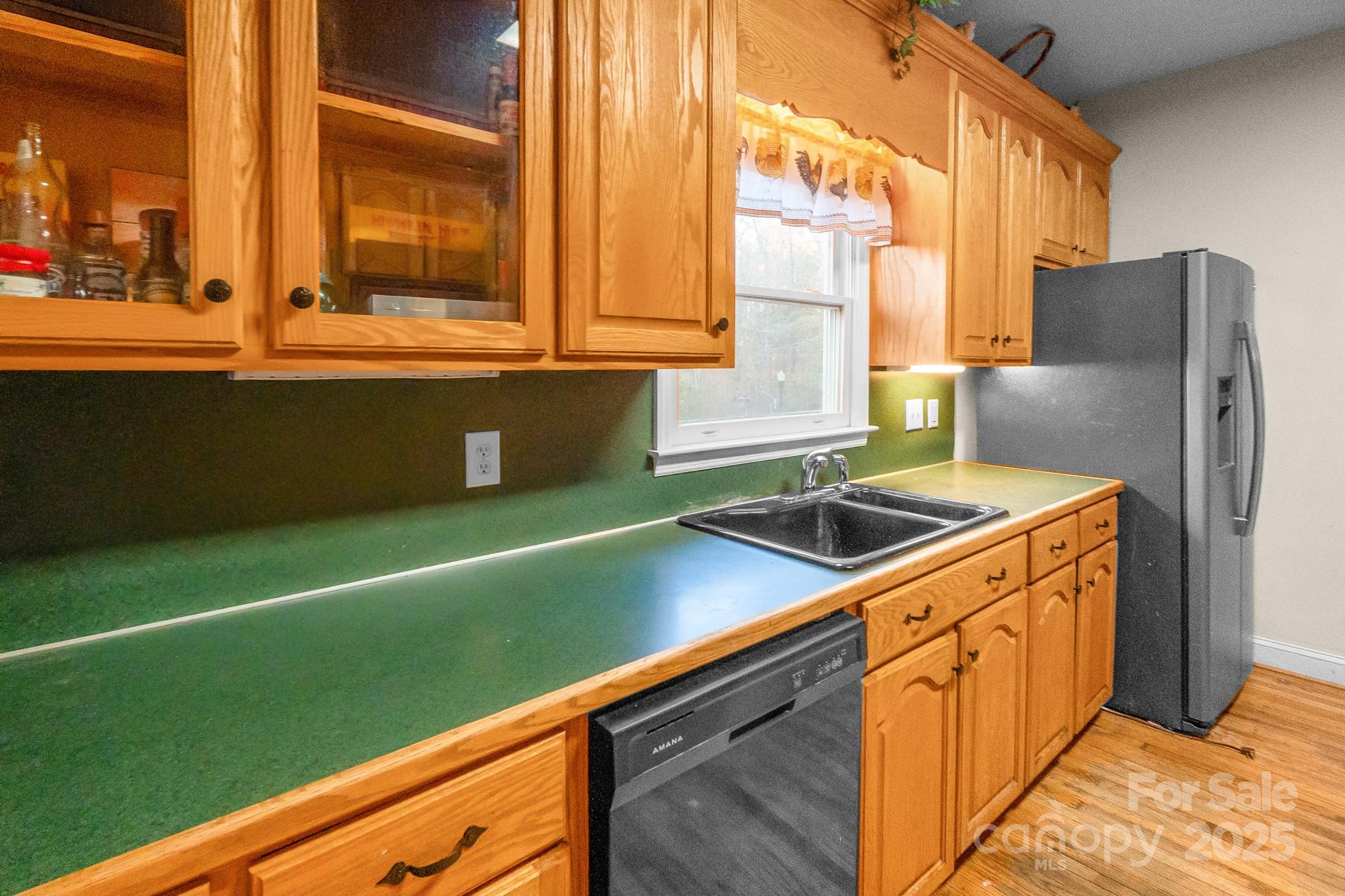 2775 State Rd S-29-285 Lancaster, SC 29720 - Photo 24 of 48 a kitchen with a sink cabinets and a large window