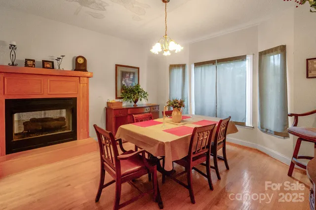 a dining room with furniture and window