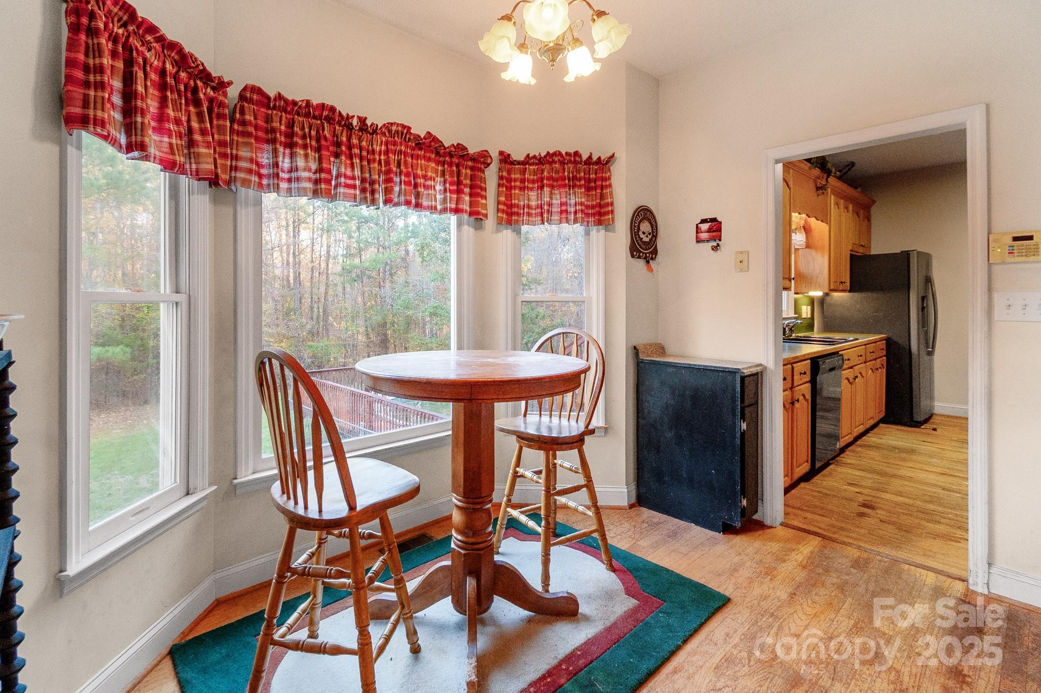 2775 State Rd S-29-285 Lancaster, SC 29720 - Photo 30 of 48 a view of a dining room with furniture window and wooden floor