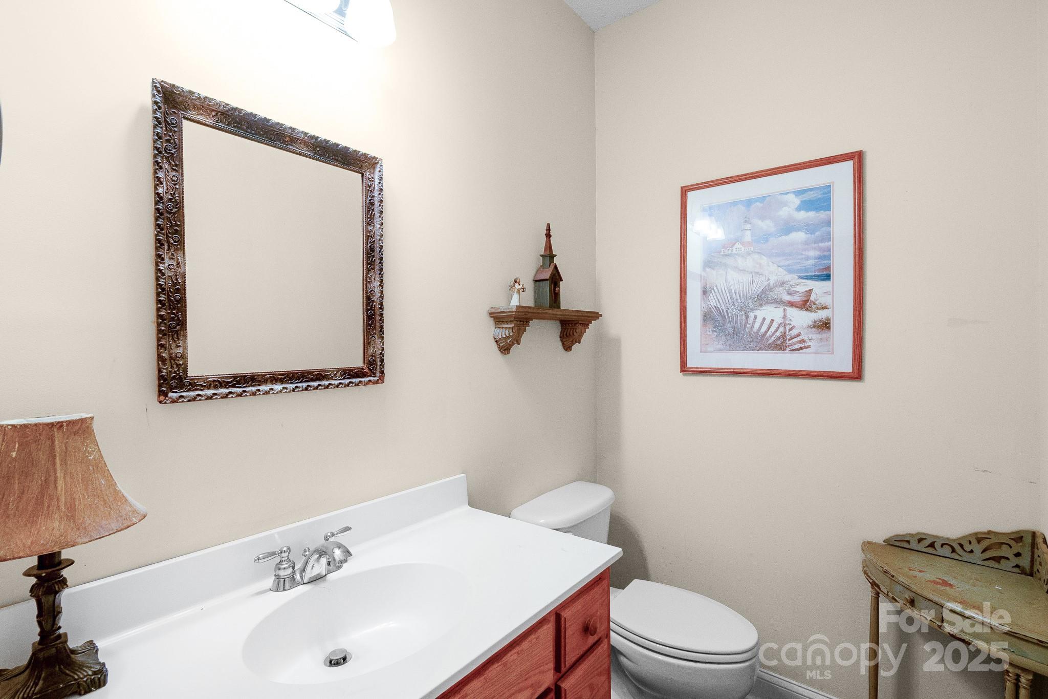 2775 State Rd S-29-285 Lancaster, SC 29720 - Photo 32 of 48 a bathroom with a sink and a mirror