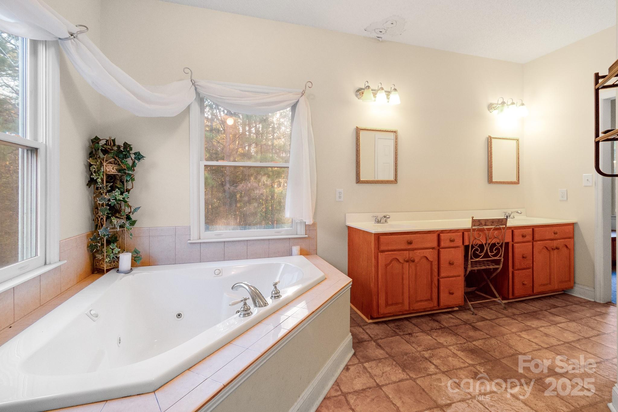 2775 State Rd S-29-285 Lancaster, SC 29720 - Photo 36 of 48 a bathroom with a tub sink and mirror