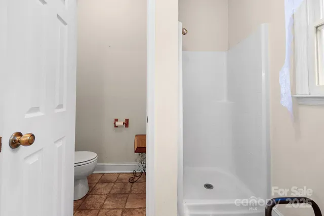 a white bath tub sitting in front of a window
