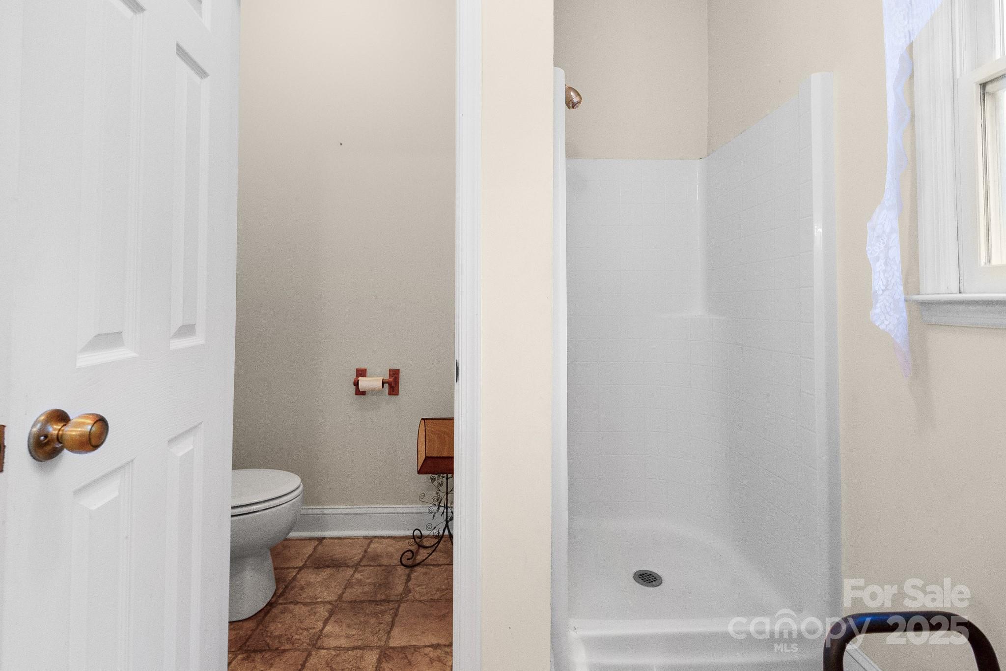 2775 State Rd S-29-285 Lancaster, SC 29720 - Photo 37 of 48 a bathroom with a toilet and a shower