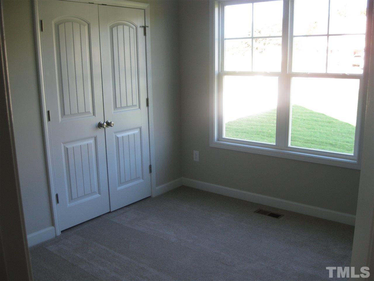 8013 Creech Road Middlesex, NC 27557 - Photo 9 of 11 an empty room with a window