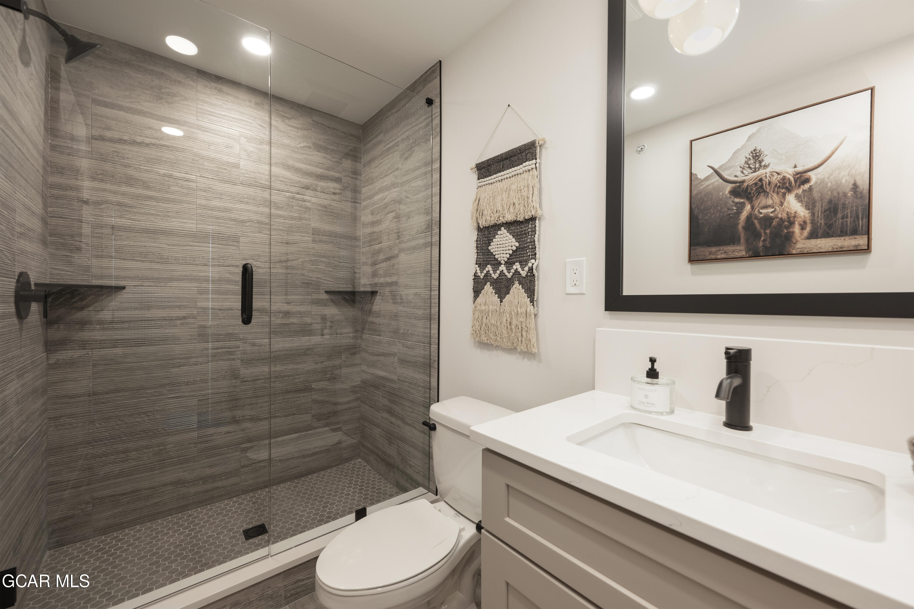 30 Wheeler Road Winter Park, CO 80482 - Photo 28 of 42 a bathroom with a sink a toilet and shower