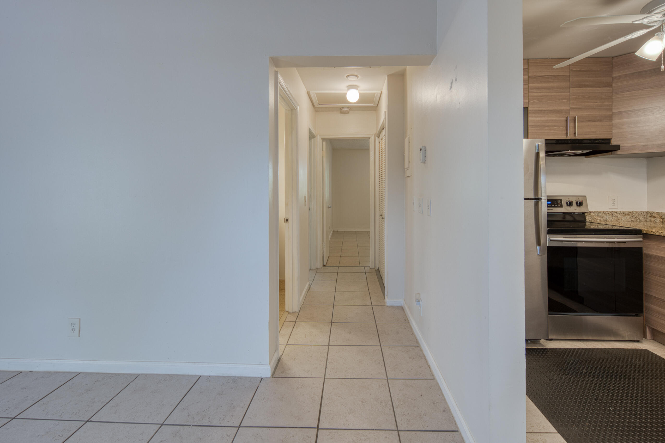 809 North Federal Highway, Unit 3 Lake Worth Beach, FL 33460 - Photo 16 of 31 a view of a kitchen from the hallway