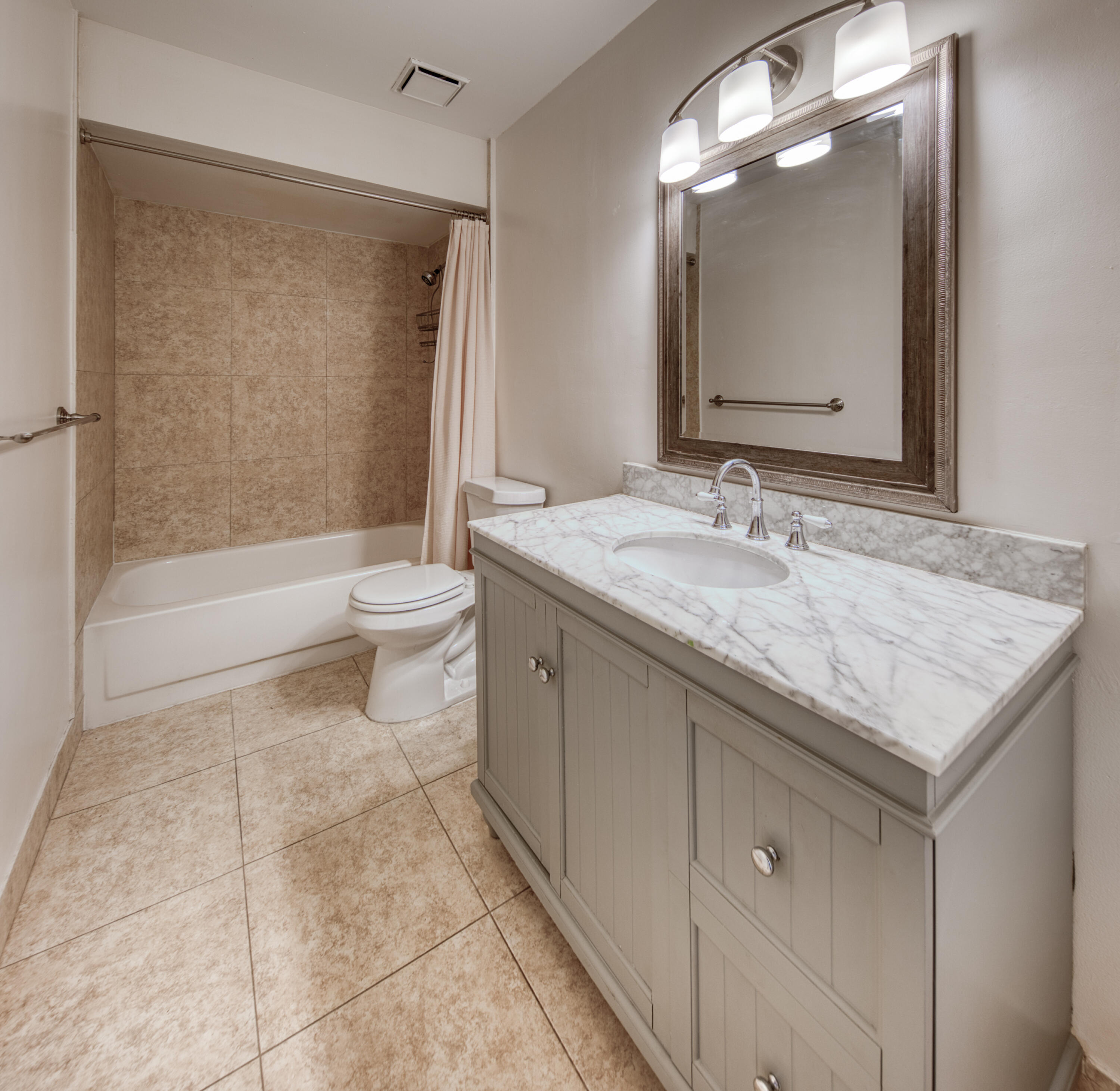 809 North Federal Highway, Unit 3 Lake Worth Beach, FL 33460 - Photo 21 of 31 a bathroom with a granite countertop sink toilet and shower