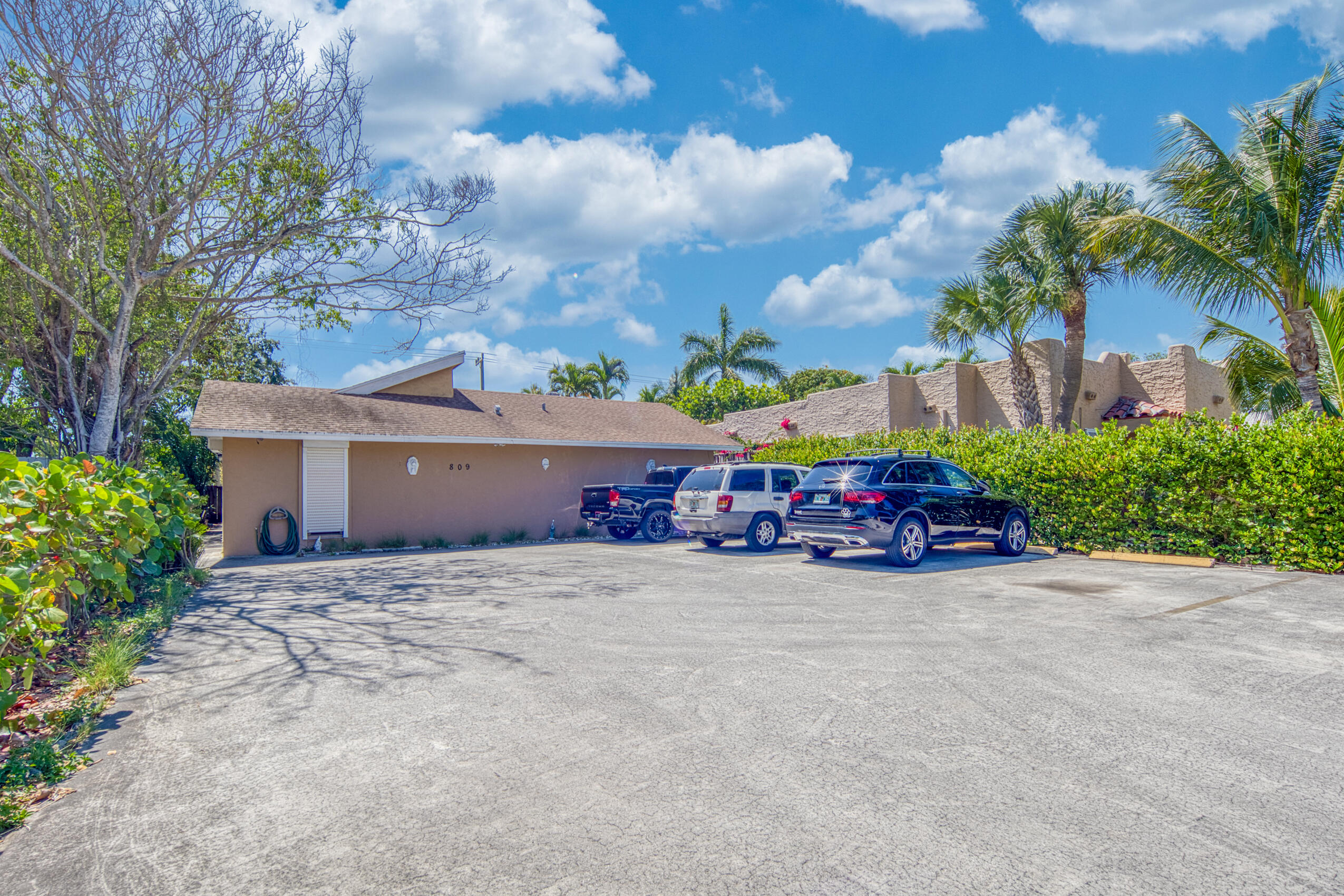 809 North Federal Highway, Unit 3 Lake Worth Beach, FL 33460 - Photo 24 of 31 front view of house with outdoor space and of trees