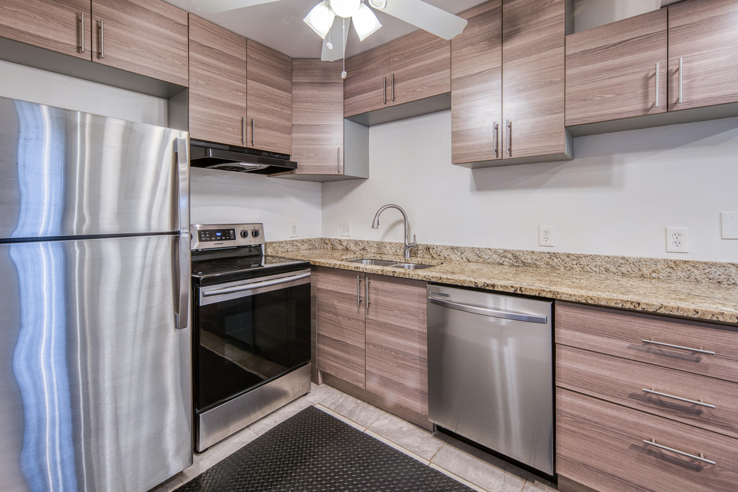 809 North Federal Highway, Unit 3 Lake Worth Beach, FL 33460 - Photo 5 of 31 a kitchen with stainless steel appliances granite countertop a sink a stove a refrigerator and cabinets