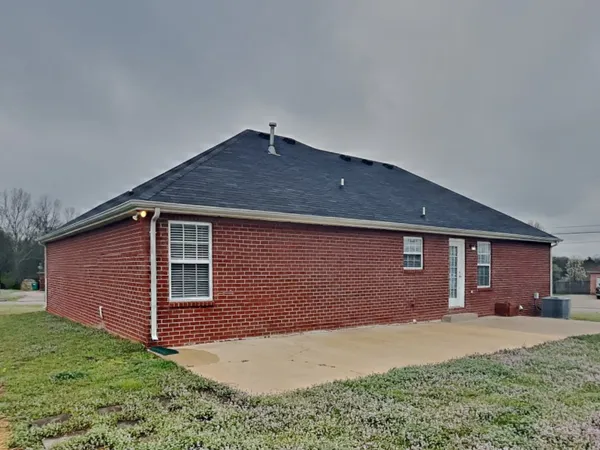 a backyard of a house with lots of green space