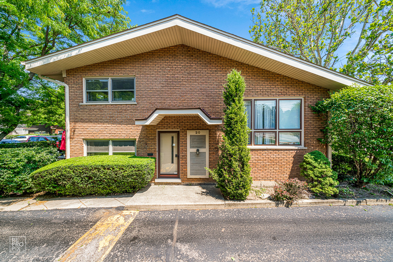 20 North Dee Road Park Ridge, IL 60068 - Photo 1 of 15 a front view of a house with a yard and garage