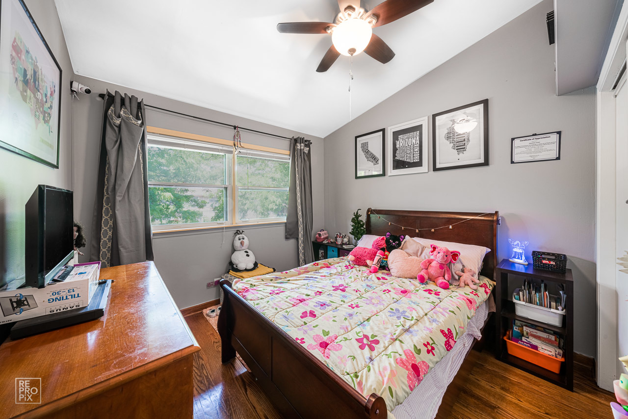 20 North Dee Road Park Ridge, IL 60068 - Photo 14 of 15 a bedroom with a bed and a flat screen tv