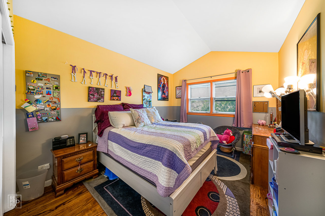 20 North Dee Road Park Ridge, IL 60068 - Photo 15 of 15 a bedroom with a bed and a flat tv screen on the dresser