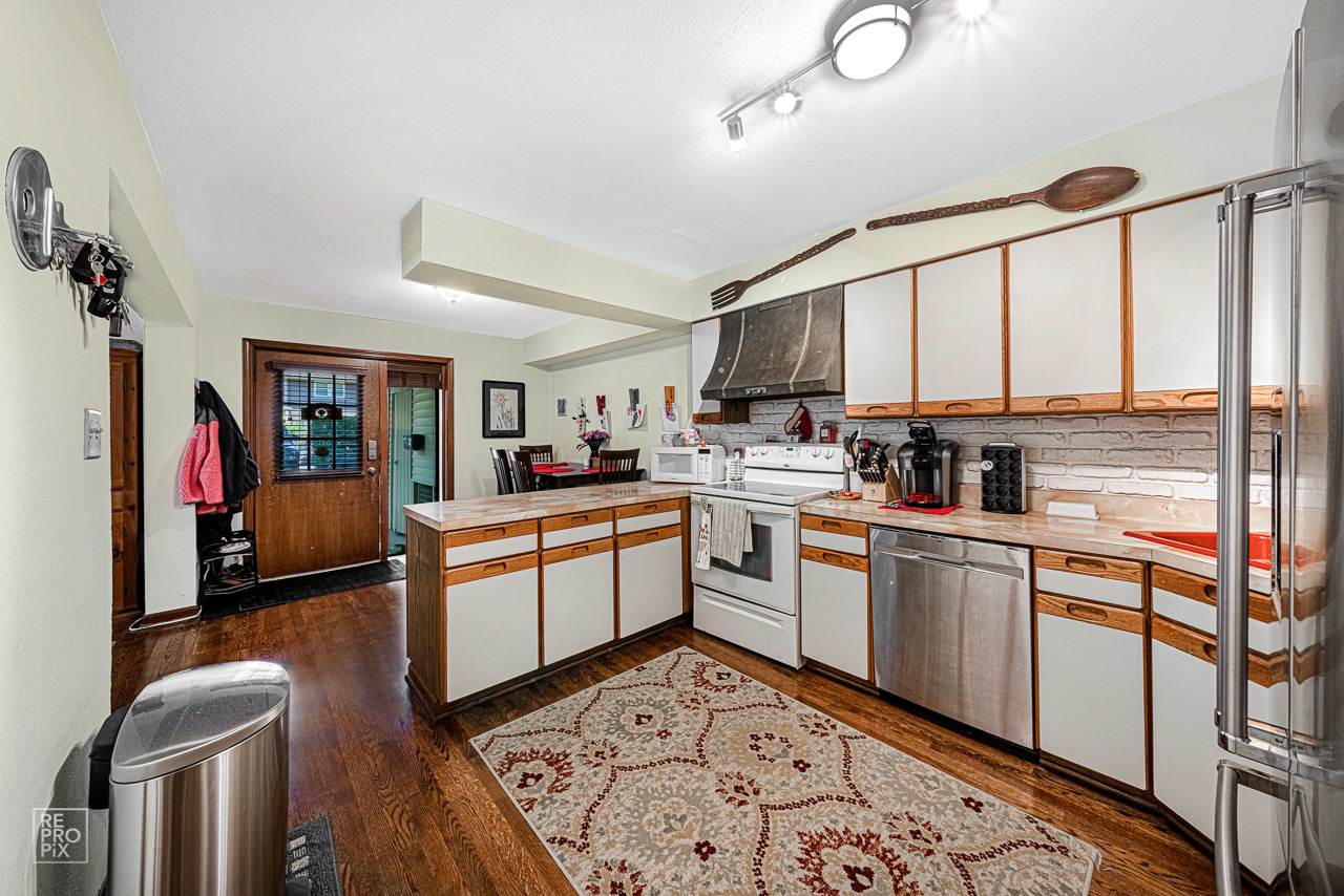 20 North Dee Road Park Ridge, IL 60068 - Photo 6 of 15 a kitchen with a sink appliances cabinets and furniture