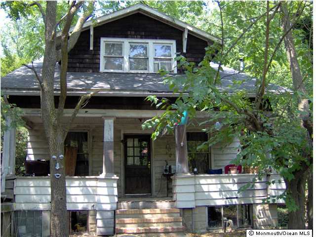 278 Spring Valley Road Morganville, NJ 07751 - Photo 1 of 3 a front view of a house with parking