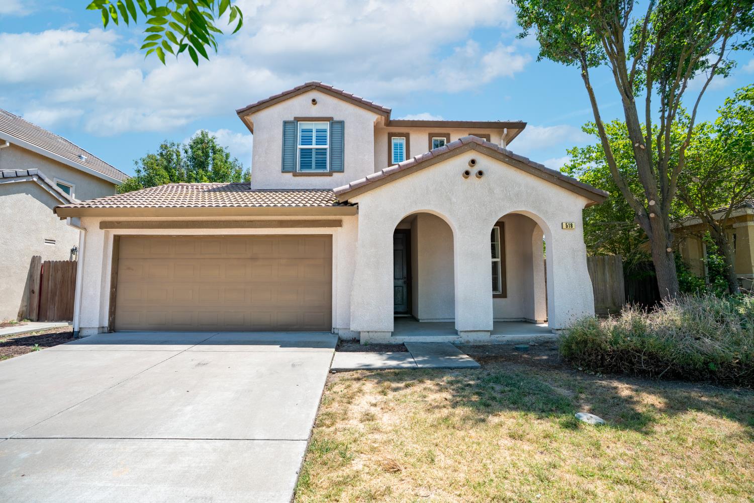 518 Barclay Way Merced, CA 95348 - Photo 1 of 1 a front view of a house with a yard