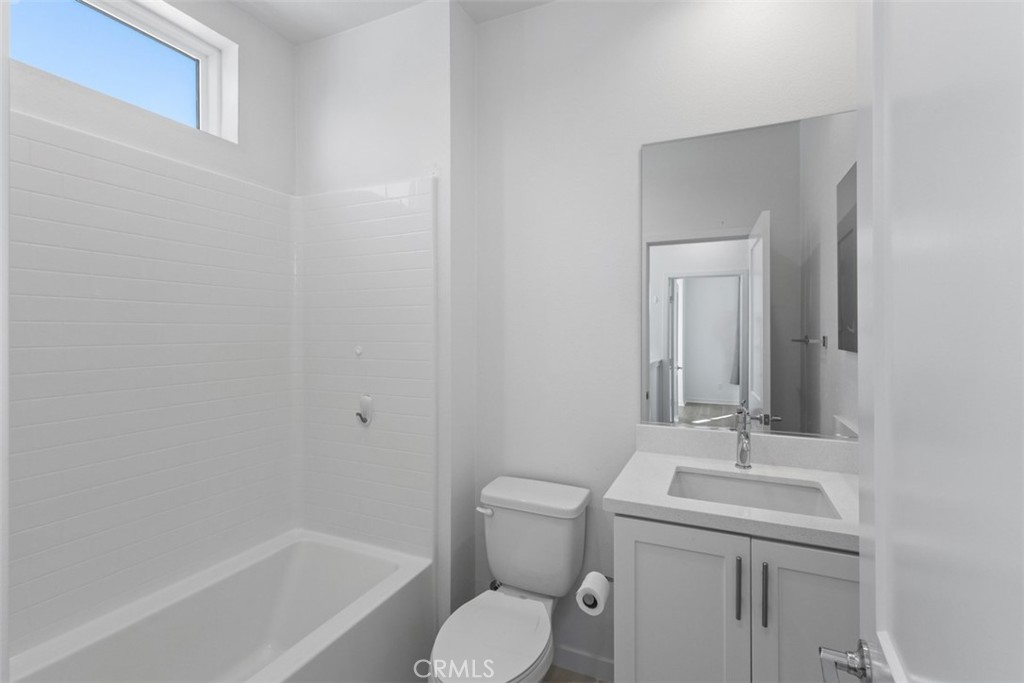 109 Mirth Irvine, CA 92618 - Photo 13 of 43 a bathroom with a toilet sink and mirror