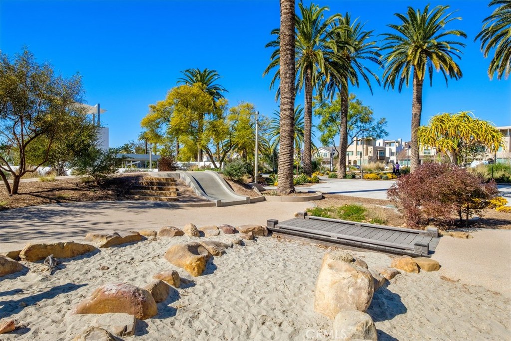 109 Mirth Irvine, CA 92618 - Photo 37 of 43 a view of swimming pool with a lawn chairs and palm trees