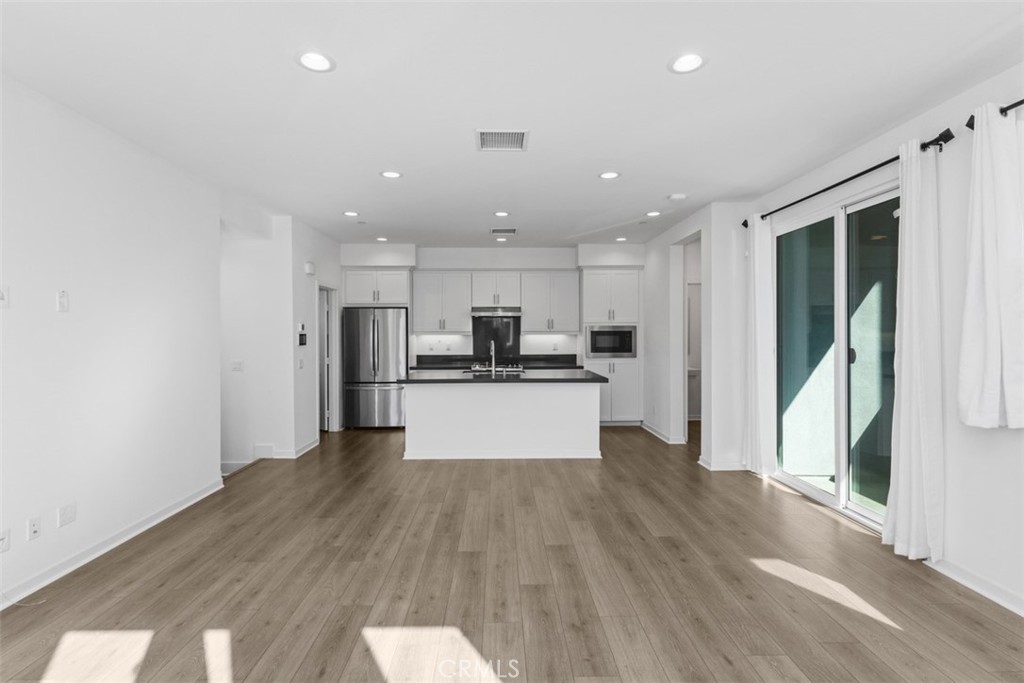 109 Mirth Irvine, CA 92618 - Photo 8 of 43 a view of kitchen with wooden floor