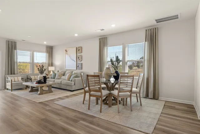 a kitchen with white cabinets sink and stainless steel appliances