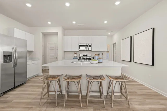 a bedroom with a large bed and a large window