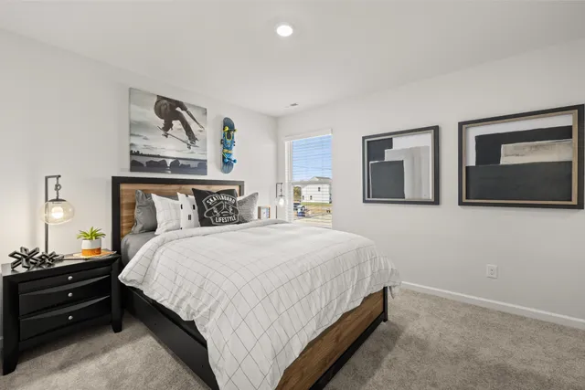 a bedroom with a bed and window