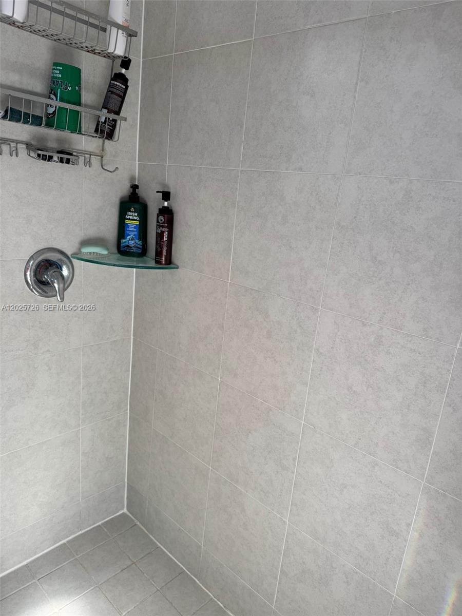 10020 Southwest 228th Terrace Miami, FL 33190 - Photo 14 of 22 a bathroom with a shower