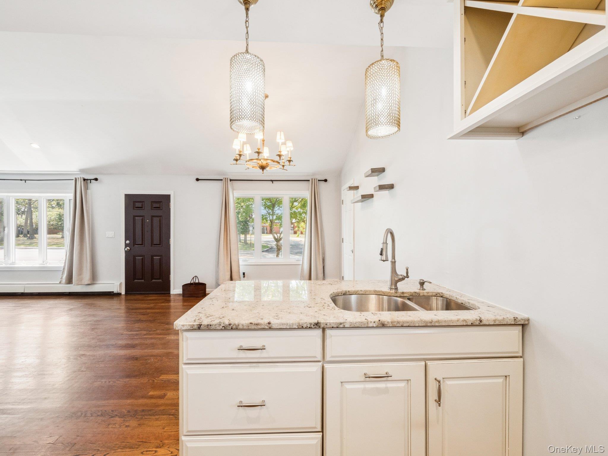 247 Woods Road North Babylon, NY 11703 - Photo 11 of 43 a bathroom with a sink and a mirror