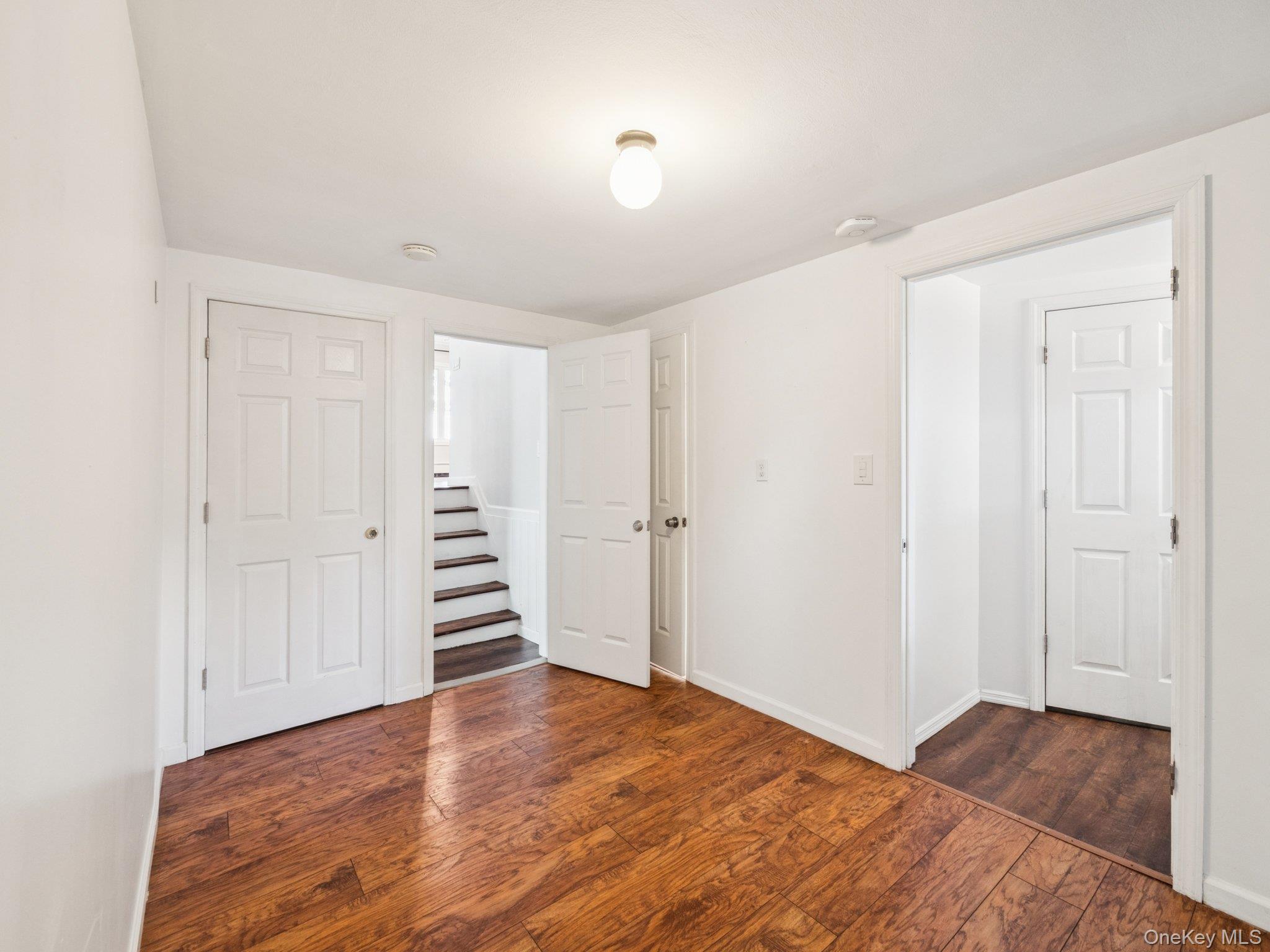 247 Woods Road North Babylon, NY 11703 - Photo 31 of 43 a view of a room with wooden floor and entryway