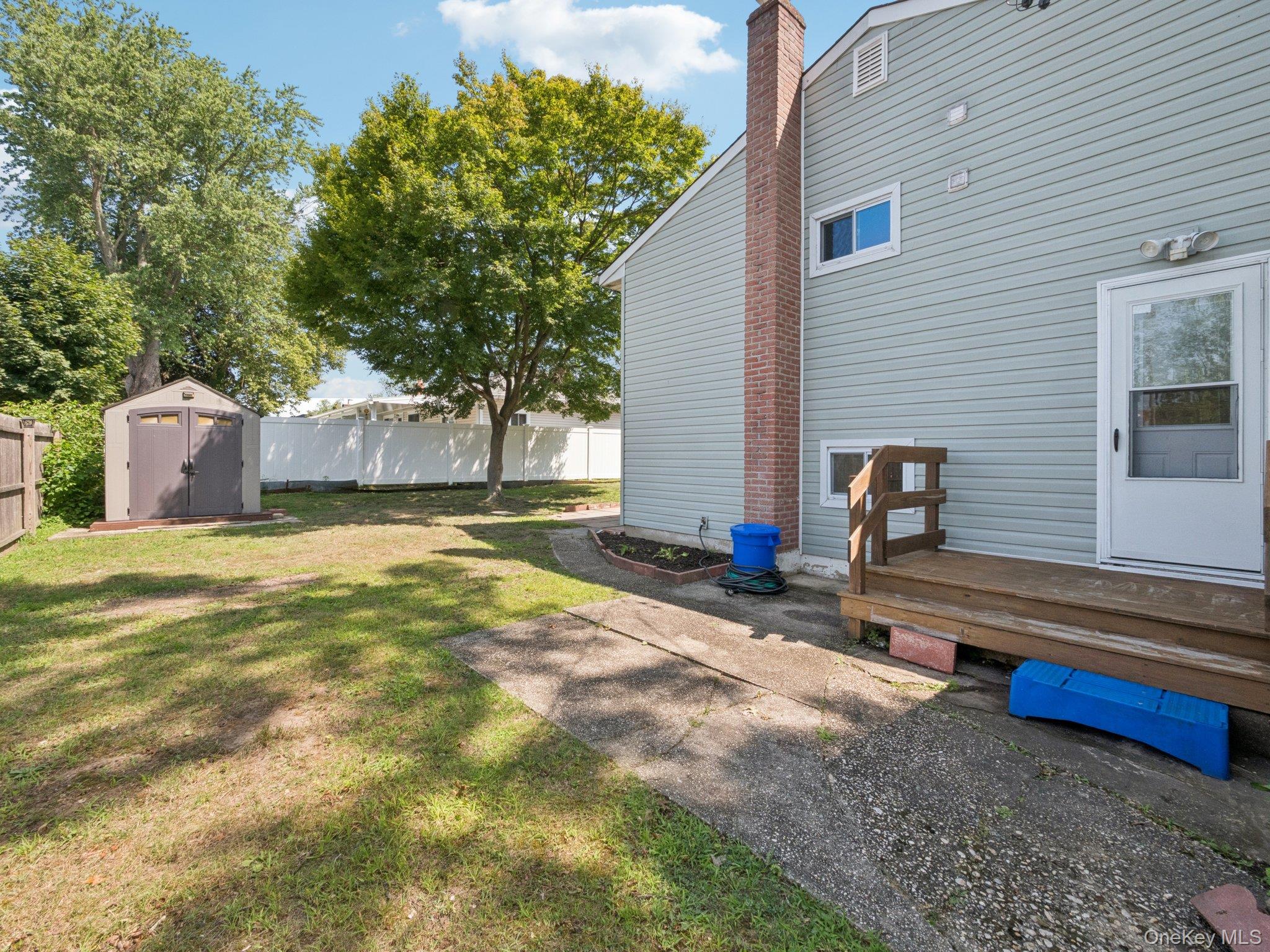 247 Woods Road North Babylon, NY 11703 - Photo 38 of 43 a house view with a backyard space