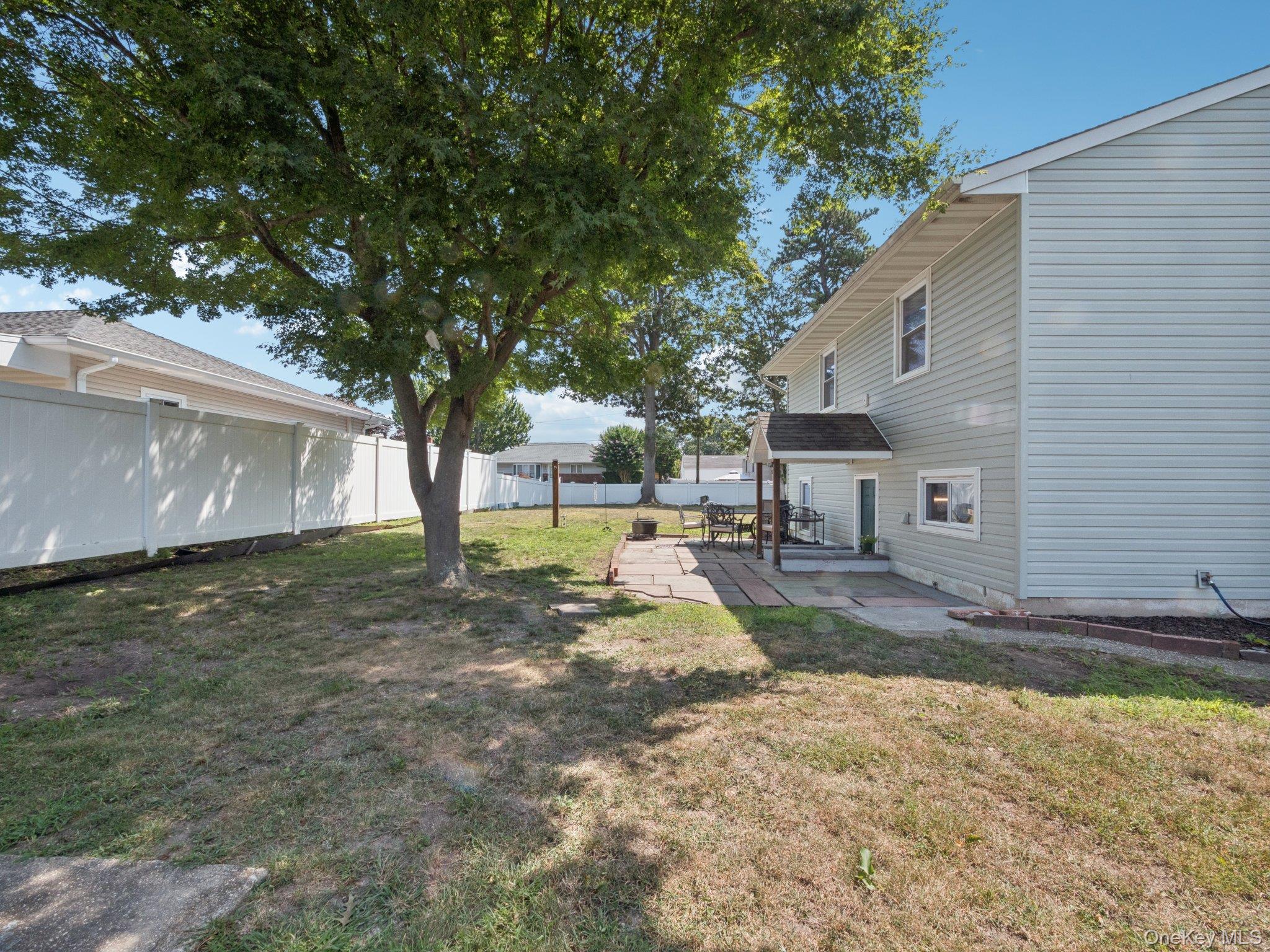 247 Woods Road North Babylon, NY 11703 - Photo 39 of 43 a view of a back yard of the house