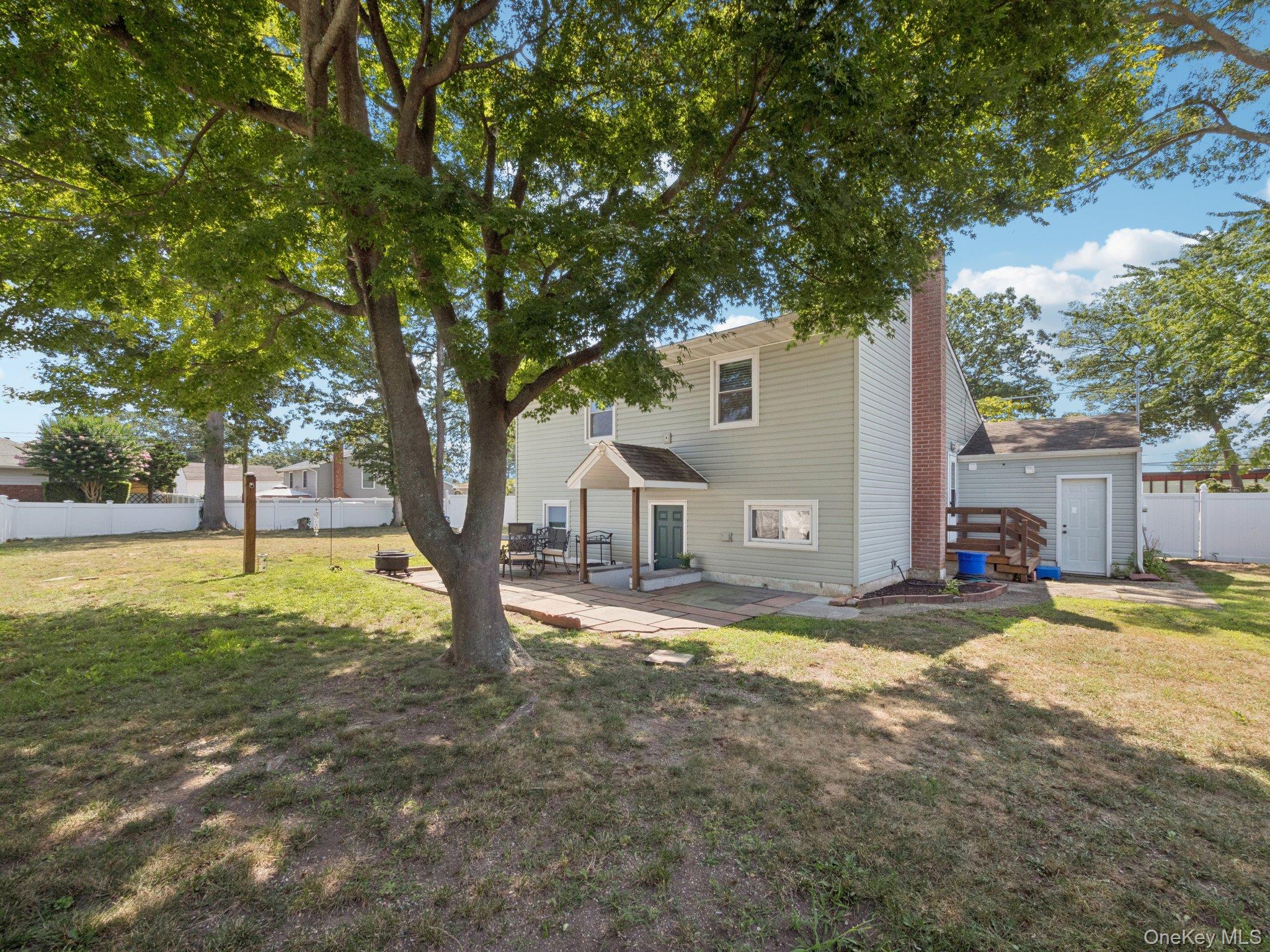 247 Woods Road North Babylon, NY 11703 - Photo 40 of 43 a view of a house with a yard and tree s