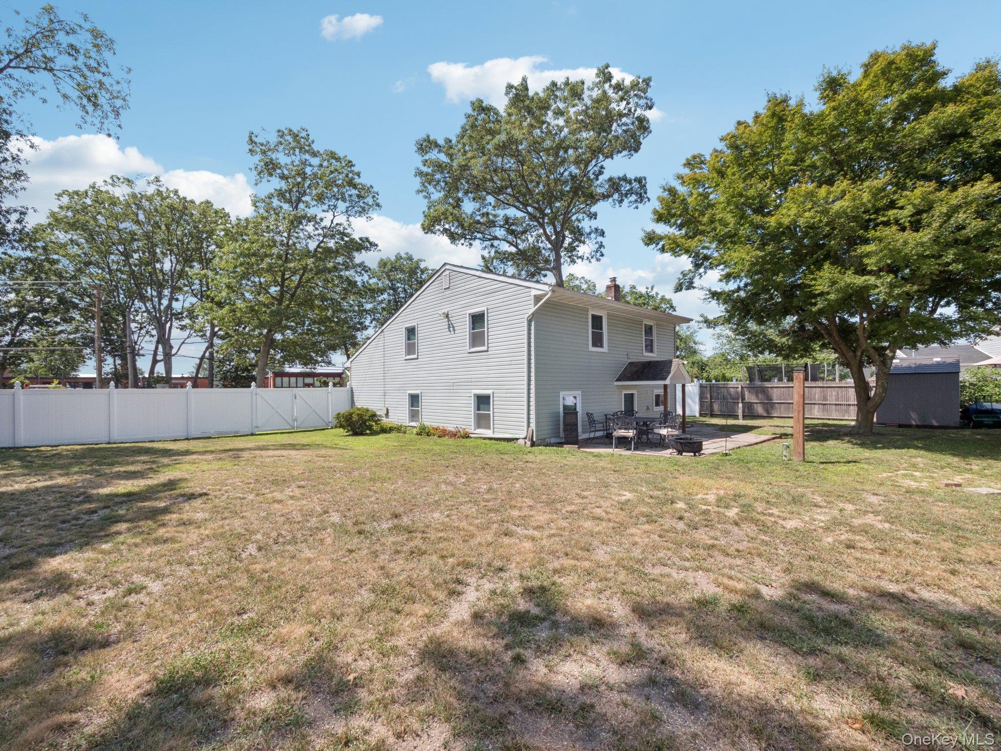 247 Woods Road North Babylon, NY 11703 - Photo 43 of 43 a view of a house with a yard