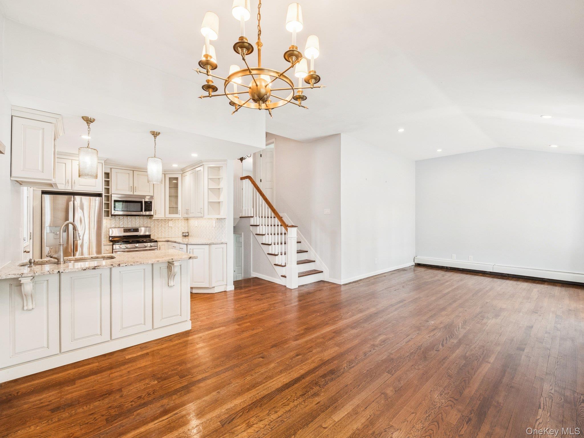 247 Woods Road North Babylon, NY 11703 - Photo 6 of 43 a view of a kitchen with wooden floor
