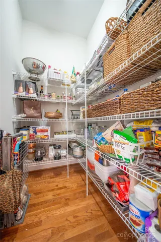 a cabinet with outdoor seating and a potted plant