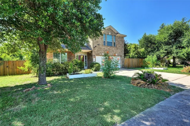 a view of a house with a yard porch and sitting area