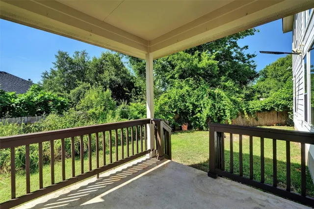 a view of a street view from a balcony