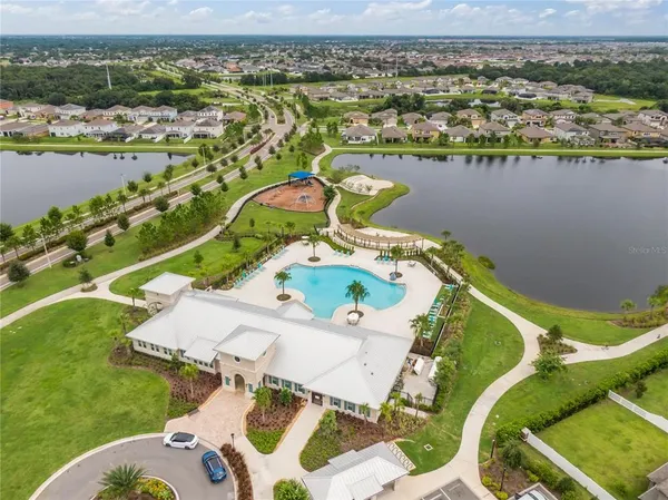 an aerial view of a house with a lake view