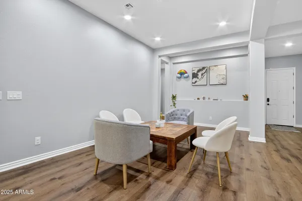 a workspace with furniture and wooden floor
