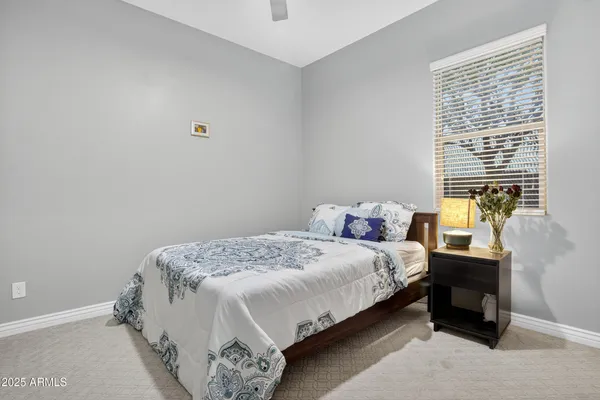 a bedroom with a bed and window