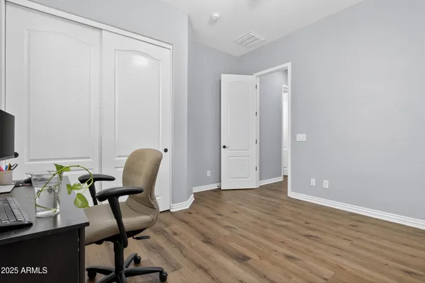 a workspace with furniture and wooden floor