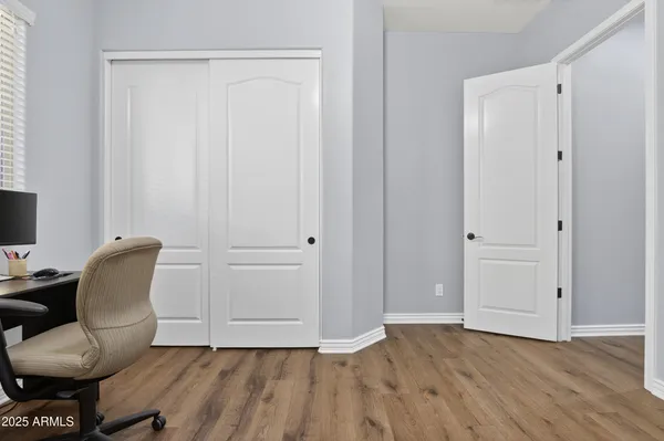 a view of room with hardwood floor and lounge chair